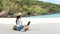 Lifestyle freelance woman using laptop working and relax on the beach.Â 